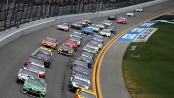 DAYTONA BEACH, FLORIDA - JULY 07: Joey Logano, driver of the #22 Shell Pennzoil Ford, and Kyle Busch, driver of the #18 Interstate Batteries Toyota, lead the field during the Monster Energy NASCAR Cup Series Coke Zero Sugar 400 at Daytona International Speedway on July 07, 2019 in Daytona Beach, Florida. (Photo by Matt Sullivan/Getty Images)
