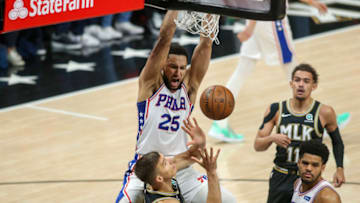 Jun 14, 2021; Atlanta, Georgia, USA; Philadelphia 76ers guard Ben Simmons (25) dunks over Atlanta Hawks guard Bogdan Bogdanovic (13) in the first quarter during game four in the second round of the 2021 NBA Playoffs at State Farm Arena. Mandatory Credit: Brett Davis-USA TODAY Sports