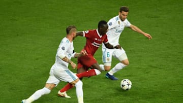 KIEV, UKRAINE - MAY 26: Sadio Mane of Liverpool, Nacho Fernandez and Sergio Ramos of Real Madrid in action during the UEFA Champions League Final between Real Madrid and Liverpool at NSC Olimpiyskiy Stadium on May 26, 2018 in Kiev, Ukraine. (Photo by Mike Hewitt/Getty Images)