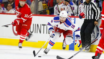 Jan 22, 2016; Raleigh, NC, USA; New York Rangers forward Derick Brassard (16) skates with the puck against the Carolina Hurricanes at PNC Arena. The New York Rangers defeated the Carolina Hurricanes 4-1. Mandatory Credit: James Guillory-USA TODAY Sports