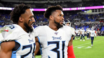BALTIMORE, MARYLAND - JANUARY 11: Logan Ryan #26 and Kevin Byard #31 of the Tennessee Titans look on during the AFC Divisional Playoff game against the Baltimore Ravens at M&T Bank Stadium on January 11, 2020 in Baltimore, Maryland. (Photo by Will Newton/Getty Images)