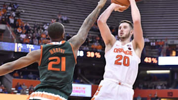 Jan 4, 2017; Syracuse, NY, USA; Syracuse Orange forward Tyler Lydon (20) takes a shot as Miami Hurricanes forward Kamari Murphy (21) defends during the second half at the Carrier Dome. Syracuse won 70-55. Mandatory Credit: Mark Konezny-USA TODAY Sports