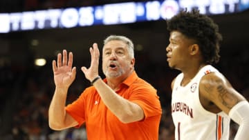 Jan 22, 2022; Auburn, Alabama, USA; Auburn Tigers head coach Bruce Pearl talks to guard Wendell Green Jr. (1) during a time out in the first half against the Kentucky Wildcats at Auburn Arena. Mandatory Credit: John Reed-USA TODAY Sports