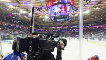 NEW YORK, NEW YORK - MARCH 14: A TV cameraman focuses on warmups prior to the game between the New York Rangers and the Washington Capitals at Madison Square Garden on March 14, 2023 in New York City. The teams were filmed as part of the "NHL Big City Greens Classic" as the game was recreated in animation and broadcast on Disney and ESPN. (Photo by Bruce Bennett/Getty Images)