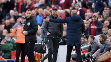 LIVERPOOL, ENGLAND - OCTOBER 07: Jurgen Klopp, Manager of Liverpool talks with Josep Guardiola, Manager of Manchester City during the Premier League match between Liverpool FC and Manchester City at Anfield on October 7, 2018 in Liverpool, United Kingdom. (Photo by Laurence Griffiths/Getty Images)