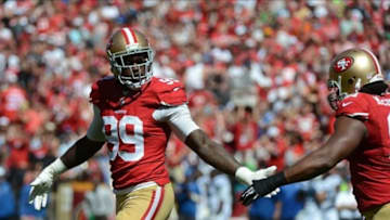 September 22, 2013; San Francisco, CA, USA; San Francisco 49ers outside linebacker Aldon Smith (99) celebrates with defensive end Ray McDonald (91, right) after tackling Indianapolis Colts quarterback Andrew Luck (12, not pictured) during the first quarter at Candlestick Park. Mandatory Credit: Kyle Terada-USA TODAY Sports