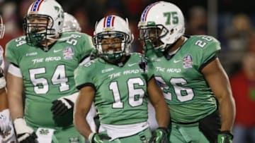 Dec 27, 2013; Annapolis, MD, USA; Marshall Herd running back Essray Taliaferro (16) celebrates his touchdown run against the Maryland Terrapins with lineman Michael Selby (54) and tight end Gator Hoskins (26) during the 2013 Military Bowl at Navy-Marine Corps Memorial Stadium. Mandatory Credit: Mitch Stringer-USA TODAY Sports