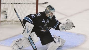 Apr 30, 2014; San Jose, CA, USA; San Jose Sharks goalie Antti Niemi (31) makes a save against the Los Angeles Kings during the third period in game seven of the first round of the 2014 Stanley Cup Playoffs at SAP Center at San Jose. The Kings defeated the Sharks 5-1. Mandatory Credit: Kyle Terada-USA TODAY Sports