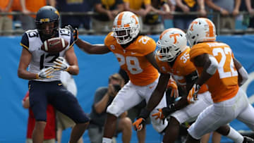 CHARLOTTE, NC - SEPTEMBER 01: The defense of the Tennessee Volunteers watch as David Sills V #13 of the West Virginia Mountaineers drops a pass in the endzone during their game at Bank of America Stadium on September 1, 2018 in Charlotte, North Carolina. (Photo by Streeter Lecka/Getty Images)
