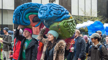 PORTLAND, OR - APRIL 14, 2018: A group walks with a two section cut out of a brain at the March for Science on April 14, 2018, in downtown Portland, OR. (Photo by Diego Diaz/Icon Sportswire via Getty Images)