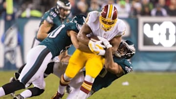 Dec 26, 2015; Philadelphia, PA, USA; Washington Redskins running back Pierre Thomas (39) is tackled by Philadelphia Eagles linebacker Kiko Alonso (50) an dinside linebacker Mychal Kendricks (95) during the second half at Lincoln Financial Field. The Redskins won 38-24. Mandatory Credit: Bill Streicher-USA TODAY Sports