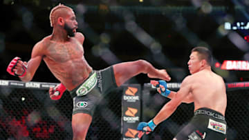 Jun 14, 2019; New York, NY, USA; Darrion Caldwell (red gloves) fights Kyoji Horiguchi (blue gloves) during Bellator 222 at Madison Square Garden. Mandatory Credit: Ed Mulholland-USA TODAY Sports