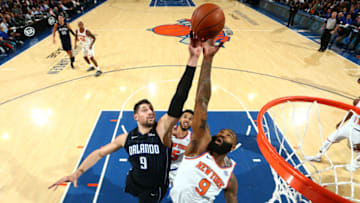 NEW YORK, NY - DECEMBER 3: Nikola Vucevic #9 of the Orlando Magic attempts to block the shot by Kyle O'Quinn #9 of the New York Knicks during the game between the two teams on December 3, 2017 at Madison Square Garden in New York, New York. NOTE TO USER: User expressly acknowledges and agrees that, by downloading and or using this Photograph, user is consenting to the terms and conditions of the Getty Images License Agreement. Mandatory Copyright Notice: Copyright 2017 NBAE (Photo by Nathaniel S. Butler/NBAE via Getty Images)