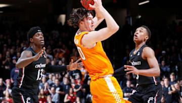 CINCINNATI, OH - DECEMBER 18: Mika Adams-Woods #3 and Tre Scott #13 of the Cincinnati Bearcats defend against John Fulkerson #10 of the Tennessee Volunteers in the first half of the game at Fifth Third Arena on December 18, 2019 in Cincinnati, Ohio. Cincinnati defeated Tennessee 78-66. (Photo by Joe Robbins/Getty Images)