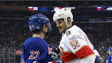 NEW YORK, NEW YORK - NOVEMBER 10: Adam Fox #23 of the New York Rangers confronts Brian Boyle #9 of the Florida Panthers following Boyle's hit on Ryan Lindgren #55 at Madison Square Garden on November 10, 2019 in New York City. The Panthers defeated the Rangers 6-5 in the shoot-out. (Photo by Bruce Bennett/Getty Images)