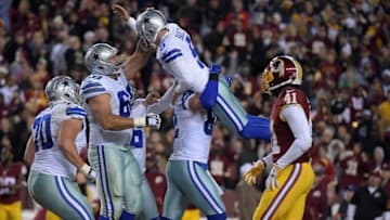 Dec 7, 2015; Landover, MD, USA; Dallas Cowboys kicker Dan Bailey (5) celebrates with guard Zack Martin (70), tackle Doug Free (68) and tight end Jason Witten (82) after kicking a 54-yard field goal for the winning points with nine seconds left against the Washington Redskins during an NFL football game at FedEx Field. The Cowboys defeated the Redskins 19-16. Mandatory Credit: Kirby Lee-USA TODAY Sports