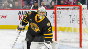 LAVAL, QC, CANADA - OCTOBER 16: Dan Vladar #30 of the Providence Bruins drops the puck to make sure the play continues against the Laval Rocket at Place Bell on October 16, 2019 in Laval, Quebec. (Photo by Stephane Dube /Getty Images)