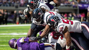 Oct 9, 2016; Minneapolis, MN, USA; Minnesota Vikings quarterback Sam Bradford (8) is sacked by Houston Texans defensive end Antonio Smith (94) and teammates during the first quarter at U.S. Bank Stadium. Mandatory Credit: Brace Hemmelgarn-USA TODAY Sports