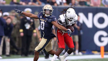 Arquon Bush of the Cincinnati Bearcats intercepts a pass against Navy Midshipmen. Getty Images.