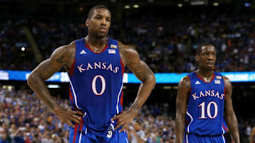 NEW ORLEANS, LA - APRIL 02: Thomas Robinson #0 and Tyshawn Taylor #10 of the Kansas Jayhawks look on in the first half while taking on the Kentucky Wildcats in the National Championship Game of the 2012 NCAA Division I Men's Basketball Tournament at the Mercedes-Benz Superdome on April 2, 2012 in New Orleans, Louisiana. (Photo by Jeff Gross/Getty Images)