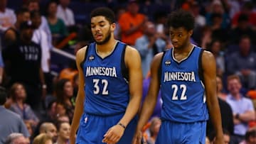 Mar 14, 2016; Phoenix, AZ, USA; Minnesota Timberwolves center Karl-Anthony Towns (32) and guard Andrew Wiggins (22) react in the closing seconds of the game against the Phoenix Suns at Talking Stick Resort Arena. The Suns defeated the Timberwolves 107-104. Mandatory Credit: Mark J. Rebilas-USA TODAY Sports