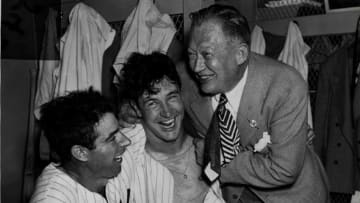 UNKNOWN - IRCA 1950: (L-R) Joe DiMaggio, Joe Page and team executive Larry MacPhail of the New York Yankees celebrate in the locker room circa 1950. . (Photo by Sporting News via Getty Images)
