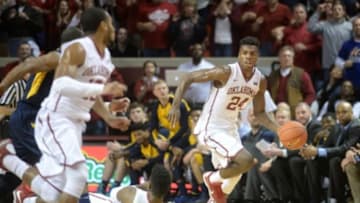 Jan 16, 2016; Norman, OK, USA; Oklahoma Sooners guard Buddy Hield (24) brings the ball up the court against the West Virginia Mountaineers during the second half at Lloyd Noble Center. Mandatory Credit: Mark D. Smith-USA TODAY Sports