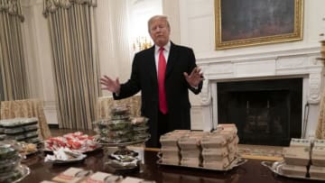 WASHINGTON, DC - JANUARY 14: (AFP OUT) U.S President Donald Trump presents fast food to be served to the Clemson Tigers football team to celebrate their Championship at the White House on January 14, 2019 in Washington, DC. (Photo by Chris Kleponis-Pool/Getty Images)