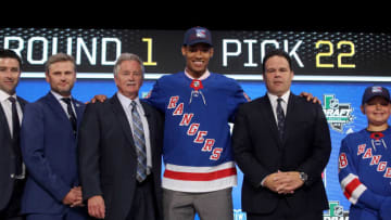 K'Andre Miller poses after being selected by the New York Rangers (Photo by Bruce Bennett/Getty Images)