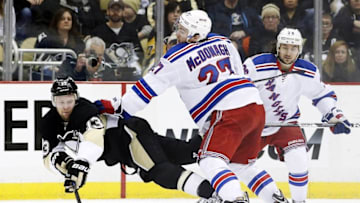 Jan 18, 2015; Pittsburgh, PA, USA; New York Rangers defenseman Ryan McDonagh (27) checks Pittsburgh Penguins center Nick Spaling (13) during the third period at the CONSOL Energy Center. The Rangers won 5-2. Mandatory Credit: Charles LeClaire-USA TODAY Sports