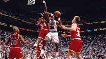 SALT LAKE CITY, UT - 1995: Karl Malone #32 of the Utah Jazz drives against Hakeem Olajuwon #34 of the Houston Rockets in Game Five of the Western Conference Quarterfinals as part of the 1995 NBA Playoffs at the Delta Center in Salt Lake City, Utah circa 1995. Copyright 1995 NBAE (Photo by Andrew D Bernstein/NBAE via Getty Images)
