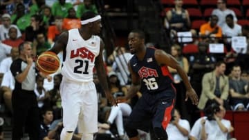 Jul 25, 2013; Las Vegas, NV, USA; USA White Team guard Ty Lawson (21) dribbles the ball while being defended by USA Blue Team guard Kemba Walker during the 2013 USA Basketball Showcase at the Thomas and Mack Center. Team White won the game 128-106. Mandatory Credit: Stephen R. Sylvanie-USA TODAY Sports