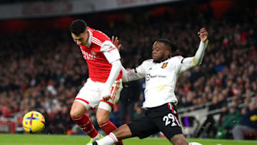 LONDON, ENGLAND - JANUARY 22: Gabriel Martinelli of Arsenal is challenged by Aaron Wan-Bissaka of Manchester United during the Premier League match between Arsenal FC and Manchester United at Emirates Stadium on January 22, 2023 in London, England. (Photo by Shaun Botterill/Getty Images)
