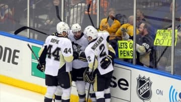 May 11, 2013; Uniondale, NY, USA; The Pittsburgh Penguins celebrate a goal by Pittsburgh Penguins right wing Pascal Dupuis (9) against the New York Islanders during the second period of game six of the first round of the 2013 Stanley Cup Playoffs at Nassau Veterans Memorial Coliseum. Mandatory Credit: Brad Penner-USA TODAY Sports