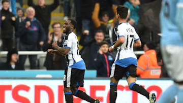 NEWCASTLE UPON TYNE, ENGLAND - APRIL 19: Vurnon Anita (L) of Newcastle United celebrates after scoring a goal to level the scores at 1-1 during the Barclays Premier League match between Newcastle United and Manchester City at St James' Park on April 19, 2016 in Newcastle, England. (Photo by Michael Regan/Getty Images)