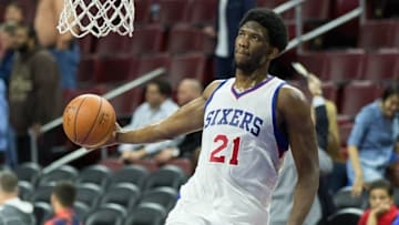 Apr 15, 2015; Philadelphia, PA, USA; Injured Philadelphia 76ers center Joel Embiid (21) dunks during warm ups before playing against the Miami Heat at Wells Fargo Center. Mandatory Credit: Bill Streicher-USA TODAY Sports
