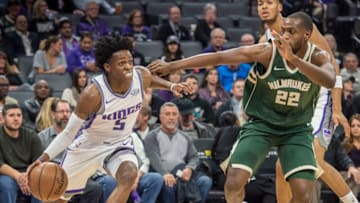 Sacramento Kings guard De'Aaron Fox (5) drives to the basket against the Milwaukee Bucks forward Khris Middleton (22) on Tuesday, Nov. 28, 2017 at Holden 1 Center in Sacramento, Calif. (Hector Amezcua/Sacramento Bee/TNS via Getty Images)