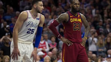 PHILADELPHIA, PA - APRIL 6: Ben Simmons #25 of the Philadelphia 76ers and LeBron James #23 of the Cleveland Cavaliers look on during foul shots at the Wells Fargo Center on April 6, 2018 in Philadelphia, Pennsylvania. NOTE TO USER: User expressly acknowledges and agrees that, by downloading and or using this photograph, User is consenting to the terms and conditions of the Getty Images License Agreement. (Photo by Mitchell Leff/Getty Images) *** Local Caption *** Ben Simmons;LeBron James