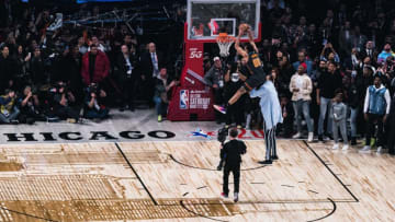 CHICAGO, ILLINOIS - FEBRUARY 15: Aaron Gordon #00 of the Orlando Magic dunks the ball over Tacko Fall of the Boston Celtics in the 2020 NBA All-Star - AT&T Slam Dunk Contest during State Farm All-Star Saturday Night at the United Center on February 15, 2020 in Chicago, Illinois. (Photo by Lampson Yip - Clicks Images/Getty Images)