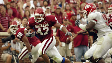NORMAN, OK - SEPTEMBER 13: Running back Renaldo Works #47 of the University of Oklahoma Sooners runs for a touchdown against the Fresno State Bulldogs at Gaylord Family Oklahoma-Memorial Stadium on September 13, 2003 in Norman, Oklahoma. The Sooners defeated the Bulldogs 52-28. (Photo by Ronald Martinez/Getty Images)