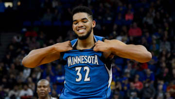 MINNEAPOLIS, MN - DECEMBER 11: Karl-Anthony Towns #32 of the Minnesota Timberwolves looks on during the game against the Golden State Warriors on December 11, 2016 at Target Center in Minneapolis, Minnesota. NOTE TO USER: User expressly acknowledges and agrees that, by downloading and or using this Photograph, user is consenting to the terms and conditions of the Getty Images License Agreement. (Photo by Hannah Foslien/Getty Images)