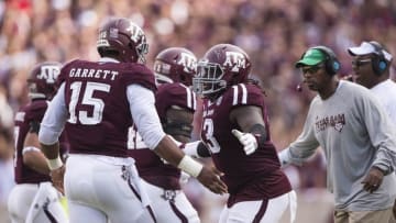 Oct 8, 2016; College Station, TX, USA; Texas A&M Aggies defensive lineman Myles Garrett (15) and defensive lineman Reggie Chevis (13) celebrate a defensive stop against the Tennessee Volunteers during the second quarter at Kyle Field. Mandatory Credit: Jerome Miron-USA TODAY Sports