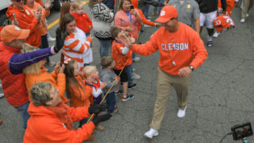Apr 9, 2022; Clemson, South Carolina, USA; Clemson head coach Dabo Swinney and players during Tiger Walk before the 2022 Orange vs White Spring Game at Memorial Stadium. Mandatory Credit: Ken Ruinard-USA TODAY Sports