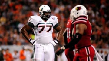 Dec 28, 2013; Orlando, FL, USA; Miami Hurricanes offensive linesman Seantrel Henderson (77) as they face the Louisville Cardinals in the Russell Athletic Bowl at Florida Citrus Bowl Stadium. Mandatory Credit: David Manning-USA TODAY Sports