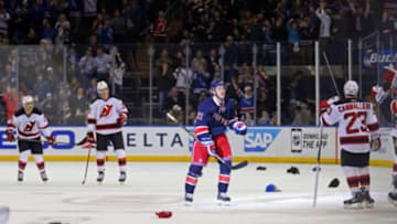 Dec 27, 2014; New York, NY, USA; New York Rangers center Derek Stepan (21) celebrates after scoring his third goal of the game against the New Jersey Devils during the third period at Madison Square Garden.The Rangers won 3-1. Mandatory Credit: Adam Hunger-USA TODAY Sports