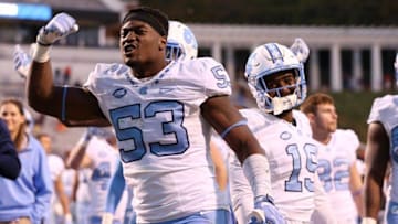 Oct 22, 2016; Charlottesville, VA, USA; North Carolina Tar Heels defensive end Malik Carney (53) celebrates with teammates after their game against the Virginia Cavaliers at Scott Stadium. The Tar Heels won 35-14. Mandatory Credit: Amber Searls-USA TODAY Sports