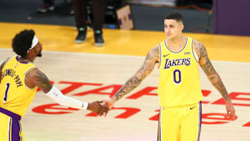 LOS ANGELES, CALIFORNIA - FEBRUARY 20: Kyle Kuzma #0 of the Los Angeles Lakers high-fives Kentavious Caldwell-Pope #1 after the game against the Miami Heat at Staples Center on February 20, 2021 in Los Angeles, California. NOTE TO USER: User expressly acknowledges and agrees that, by downloading and or using this photograph, User is consenting to the terms and conditions of the Getty Images License Agreement. (Photo by Meg Oliphant/Getty Images)