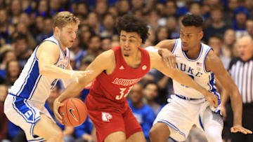 DURHAM, NORTH CAROLINA - JANUARY 18: Jordan Nwora #33 of the Louisville Cardinals is trapped by teammates Javin DeLaurier #12 and Jack White #41 of the Duke Blue Devils during their game at Cameron Indoor Stadium on January 18, 2020 in Durham, North Carolina. (Photo by Streeter Lecka/Getty Images)