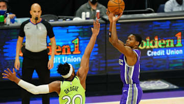 SACRAMENTO, CALIFORNIA - APRIL 20: De'Aaron Fox #5 of the Sacramento Kings shoots a three-pointer over Josh Okogie #20 of the Minnesota Timberwolves at Golden 1 Center on April 20, 2021 in Sacramento, California. NOTE TO USER: User expressly acknowledges and agrees that, by downloading and or using this photograph, User is consenting to the terms and conditions of the Getty Images License Agreement. (Photo by Daniel Shirey/Getty Images)