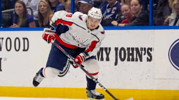 TAMPA, FL - MARCH 16: Washington Capitals defenseman Dmitry Orlov (9) brings the puck up ice during the NHL Hockey match between the Lightning and Capitols on March 16, 2019 at Amalie Arena in Tampa, FL. (Photo by Andrew Bershaw/Icon Sportswire via Getty Images)